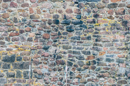 old stone wall close up on the street