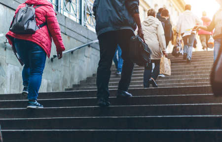 people climb the stairs from the underpass in Europeの写真素材