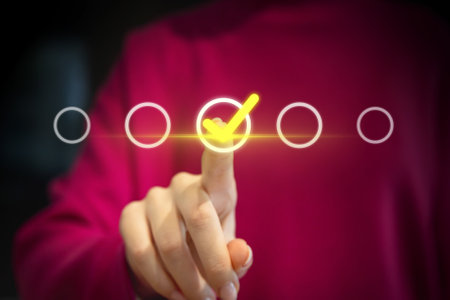 Businessman pressing check mark button on virtual screen. Business concept.の写真素材