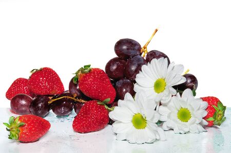 Fruit, berries and flowers on the white  backgroundの写真素材
