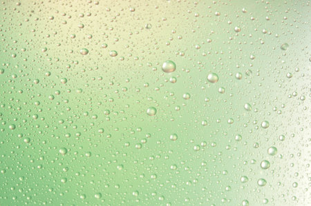 Water drops close up on a color backgroundの写真素材