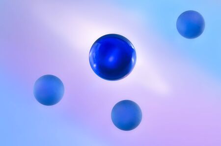 Blue glass spheres on an abstract backgroundの写真素材
