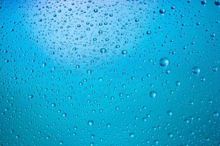 Water drops close up on a color background