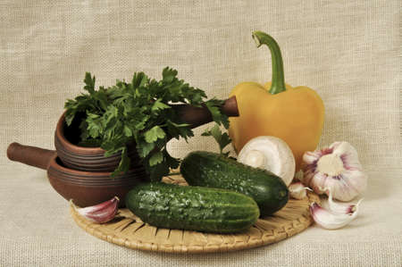 Pepper, garlic, cucumbers, mushrooms and ceramic wareの写真素材