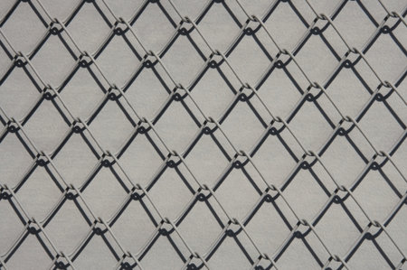 Texture of gray metal lattice on gray background close up