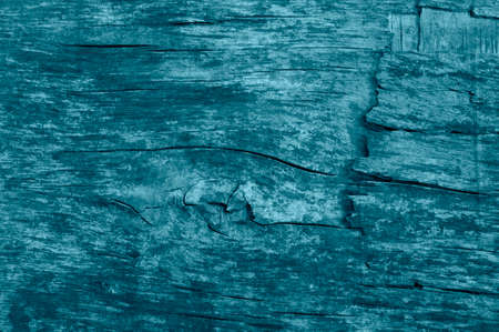 Texture of old blue wooden wall with knots and cracks close upの写真素材