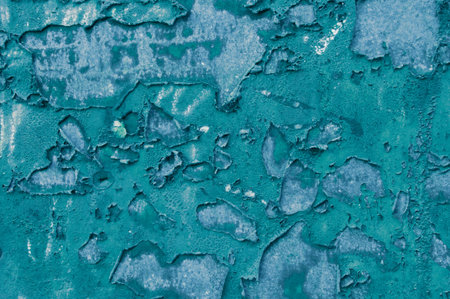 Texture of old concrete blue painted wall with peeling paint spotsの写真素材