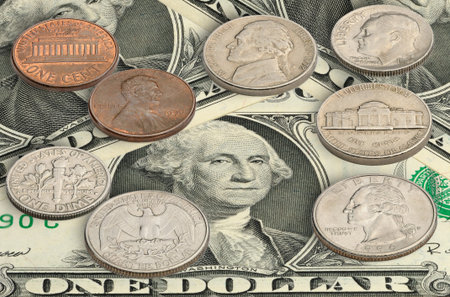 United states coins on one dollar bills.