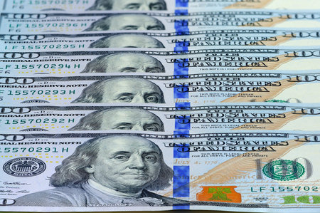Currency of the United States one hundred dollars banknotes useful as a background. Perspective...