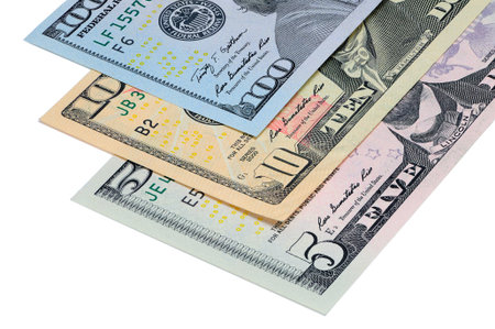 Perspective view of a part of the banknotes five, ten, one hundred dollars USA