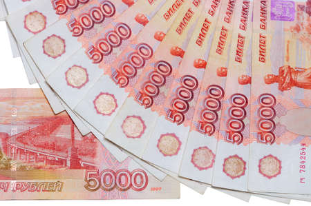 Banknotes of 5000 Russian rubles are located around as a fan and part of 5000 rubles banknotes on a white backgroundの写真素材