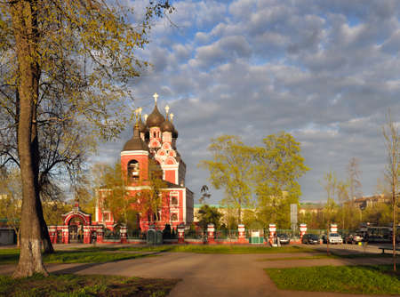 Russian Orthodox Church at sunset against the blue sky with cloudsの写真素材