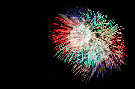 Colorful fireworks on the black sky background.の写真素材