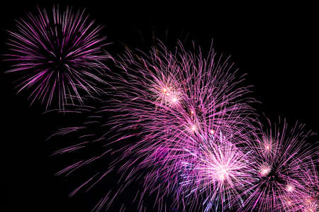 Purple amazing fireworks on dark background close upの写真素材