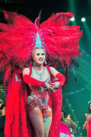 Pattaya, Thailand - August 30, 2011: Performance of the actors on stage Alcazar cabaret show in Pattaya Thailand. Male and ladyboy artists perform all the female roles in the show.のeditorial素材