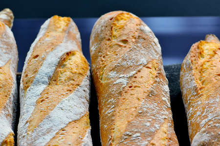 French bread baguettes on a dark blue background. Macro shootingの写真素材
