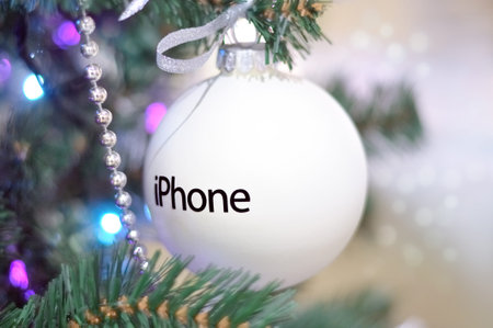 MOSCOW, Russia - December 12, 2014: Christmas ball with the iPhone logo on the Christmas tree,...