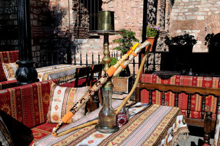 Hookah on the table at an outdoor cafe decorated in oriental styleの写真素材