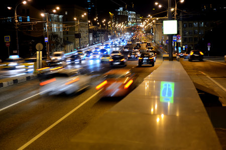 Evening car traffic on a Moscow street. Images of cars are blurred in motion