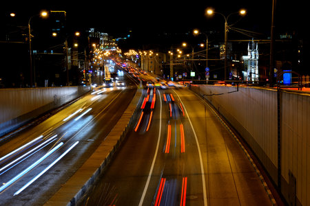 Evening car traffic on a Moscow street. Images of cars are blurred in motion