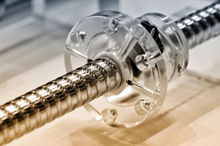 Steel rod with a screw thread and a plastic round detail. Selective toning, small depth of field. Close upの写真素材