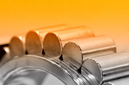 Industrial roller bearing on a light background. Red toning. Shallow depth of field, selective focusの写真素材