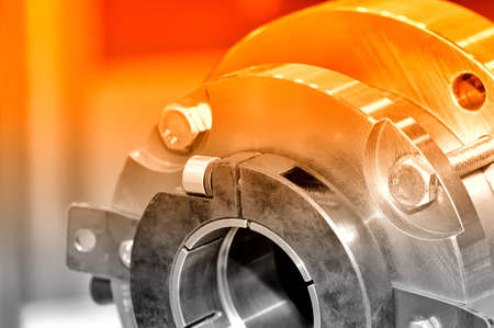 Steel parts for industrial machinery round shape. Red toning. Close upの写真素材