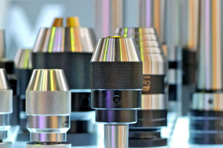 Drill chucks of different sizes on a stand. Shallow depth of fieldの写真素材