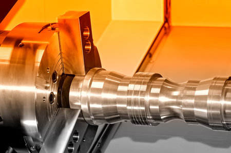 Metal detail in a spindle of the industrial lathe. Close up. Selective red toning