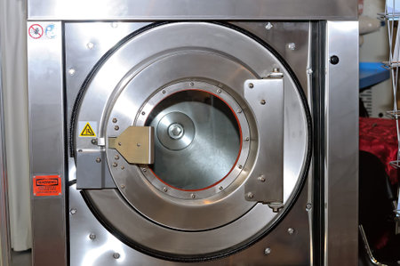 Round loading hatch of the industrial washing machine.