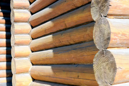 Part of a wall of the ancient traditional Russian wooden house from logsの写真素材