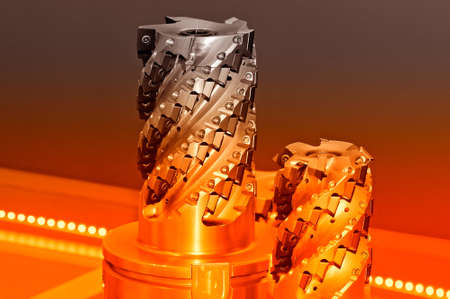 Modern industrial cutters. Cutting tools. Red toned image.の写真素材