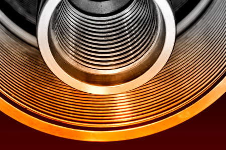 Steel tubes, cylinders with a screw thread. Red toned image. Small depth of field. Close upの写真素材