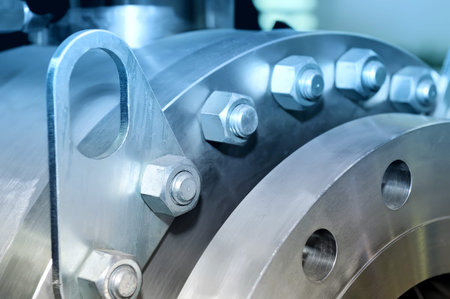 Steel parts for heavy industy machinery round shape. Blue toned image. Close up.
