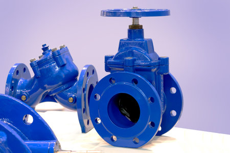 Blue industrial valves. Industrial pipeline wedge gate valve. Butterfly valve with reducer. Manual...