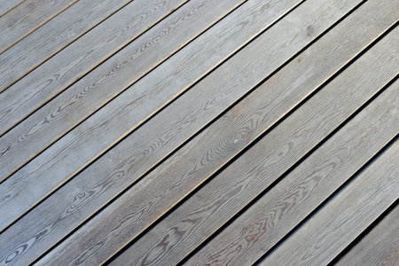 Wooden flooring, side view. Parallel boards.