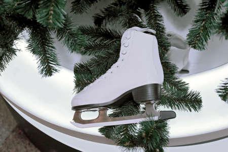 White skates for figure skating as a decoration of Christmas and New Year treeの写真素材