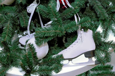 White skates for figure skating as a decoration of Christmas and New Year treeの写真素材
