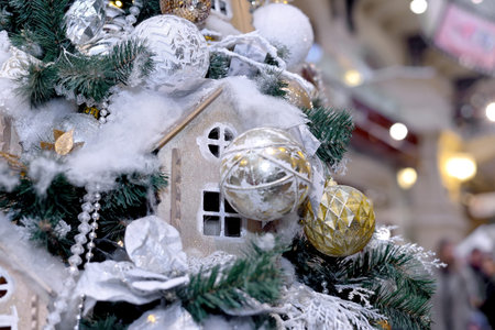 Christmas toy house and toys hang on the New Year and Christmas treeの写真素材