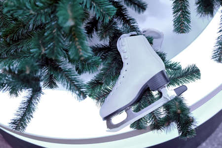 White skates for figure skating as a decoration of Christmas and New Year treeの写真素材