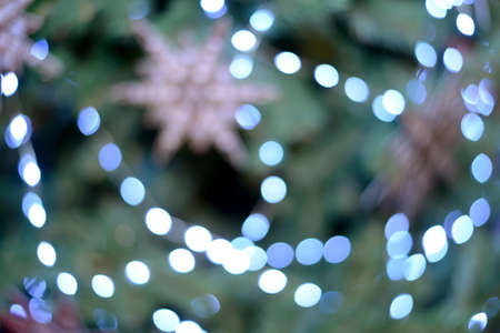 New Year and Christmas bokeh from burning lights and Christmas tree decorations.の写真素材