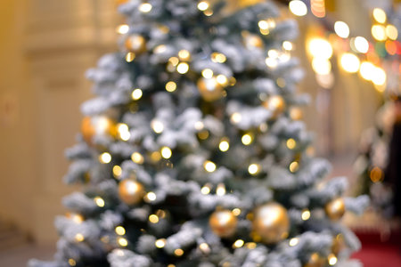 New Year and Christmas bokeh from burning lights and Christmas tree decorations.