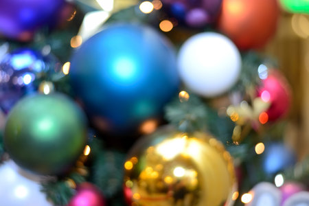 Blurry New Year and Christmas lights and Christmas toys. New Year and Christmas festive bokeh....