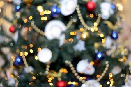 Blurry New Year and Christmas lights and Christmas toys. New Year and Christmas festive bokeh....