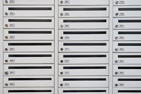 A lot of new mailboxes in an apartment building. New building, mailboxes in the lobby of an...
