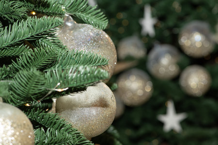 White Christmas balls and toys on the New Year and Christmas tree.の写真素材