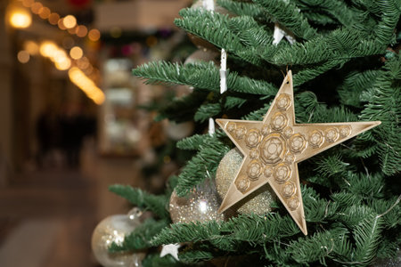 White, golden Christmas balls and toys on the New Year and Christmas tree.の写真素材