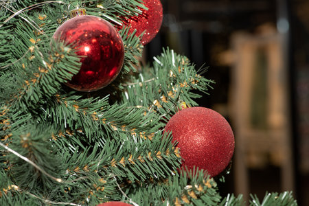 Red Christmas balls on Christmas tree. close upの写真素材