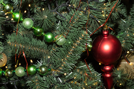 Multi-colored Christmas balls, garlands and toys on the New Year and Christmas tree.の写真素材
