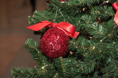 Red Christmas balls on Christmas tree. close upの写真素材